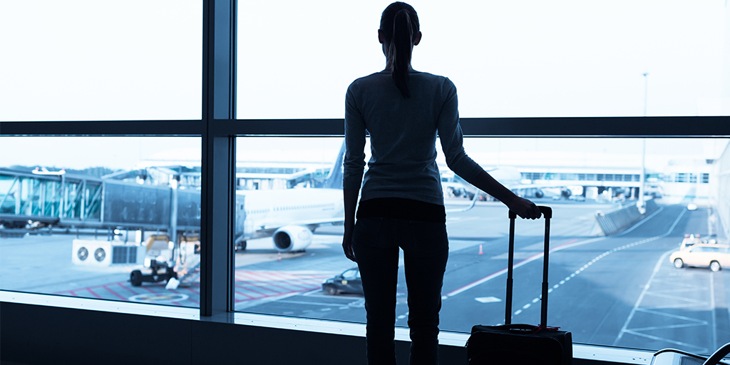 International Will - Woman standing in airport