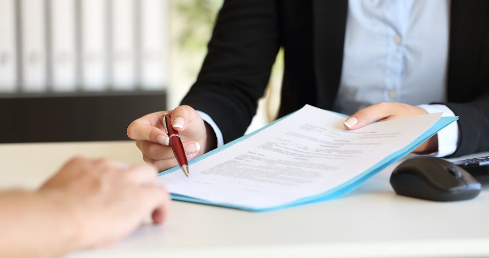 Landlord and Tenant signing documents