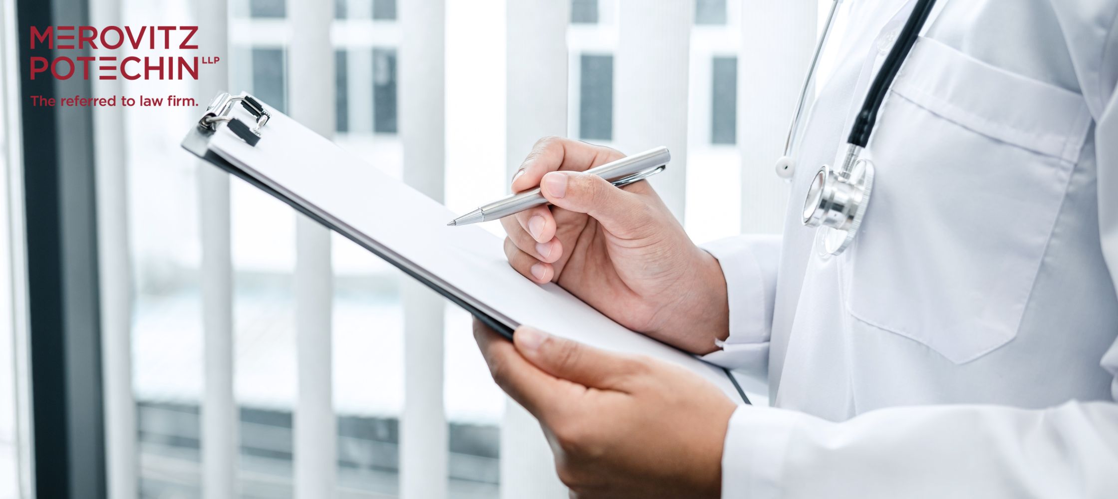 A medical expert reviewing notes on a clipboard, symbolizing the role of a medical expert in will disputes and capacity assessments.